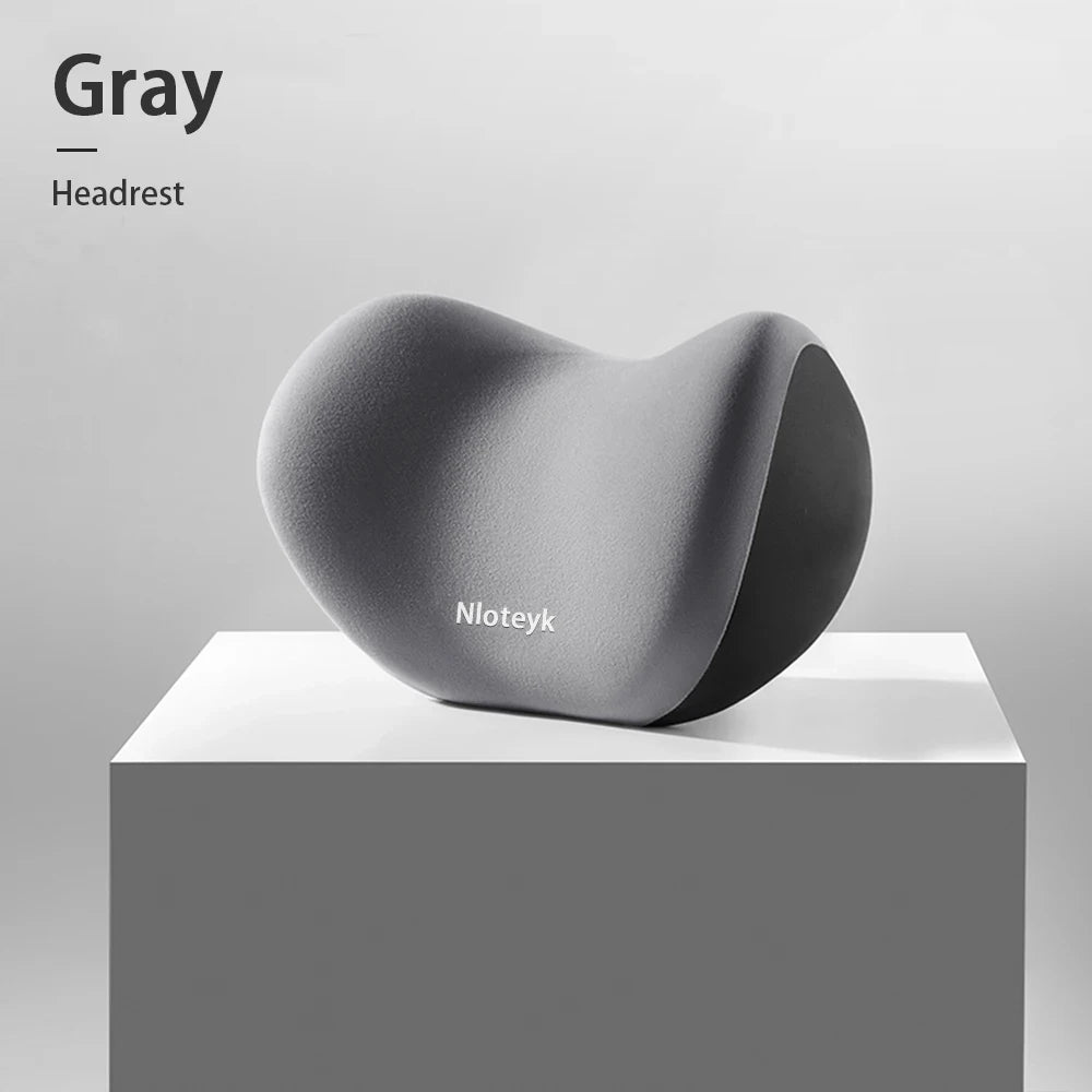 Zora memory foam car headrest pillow attached to vehicle seat for neck support and comfort during drives.
