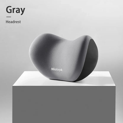 Zora memory foam car headrest pillow attached to vehicle seat for neck support and comfort during drives.
