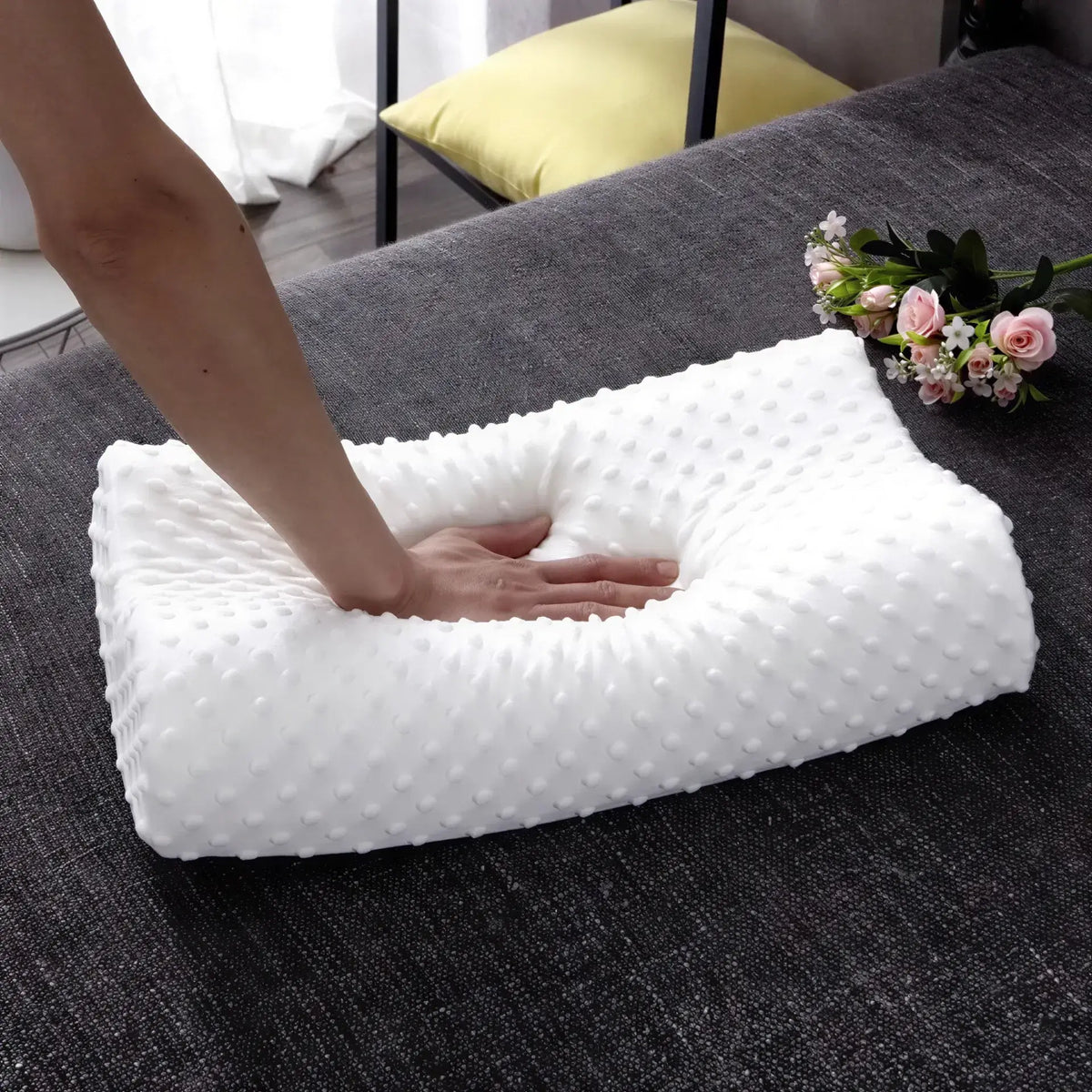 Zora adjustable memory foam pillow for side sleepers, showing the contoured shape and soft cover fabric for comfortable rest.