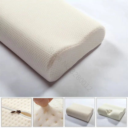 Zora ergonomic memory foam pillow with contoured shape for neck support, shown in a neutral color on a bed.