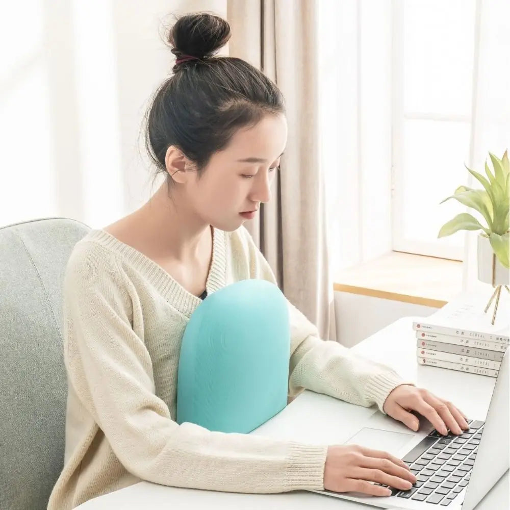 Zora portable macaron-shaped neck support pillow for travel, designed for comfortable neck support on the go.