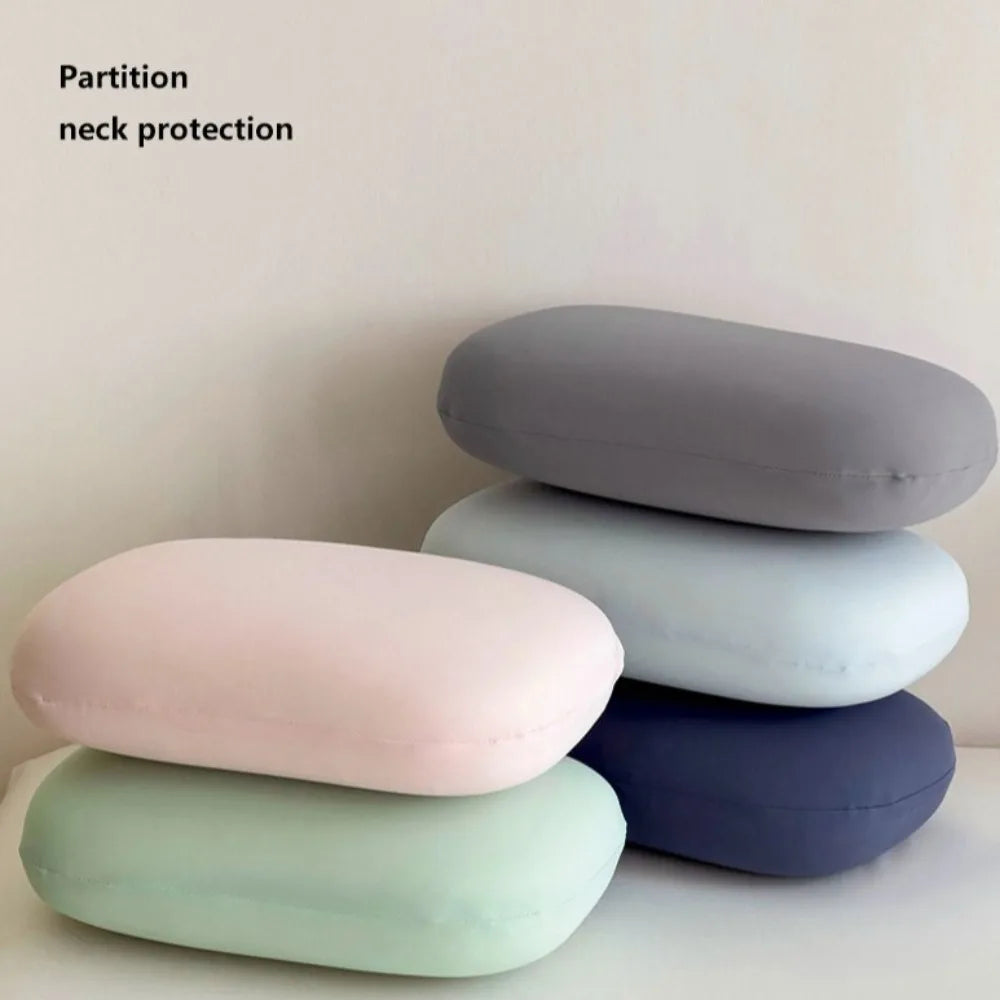 Zora portable macaron-shaped neck support pillow for travel, lightweight and comfortable for travel accessories.