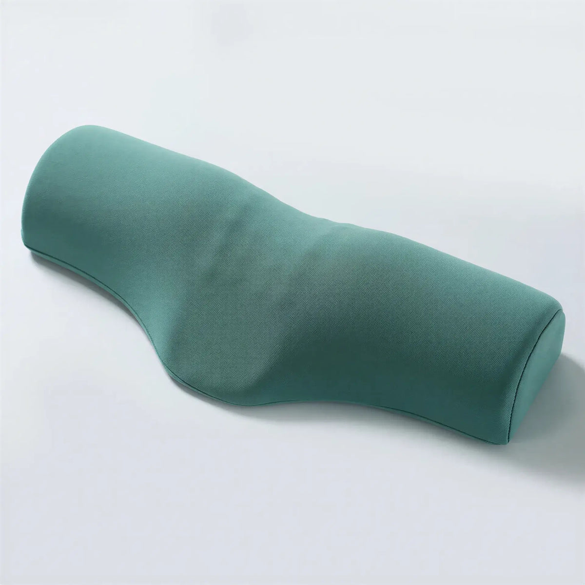Zora Contour Memory Foam Pillow with ergonomic design for neck support, shown in a neutral room setting.