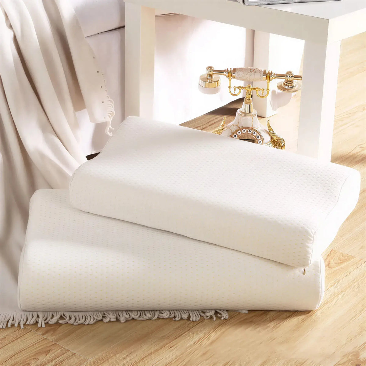 Zora ergonomic memory foam pillow with contoured design for neck support, shown in a neutral fabric cover.
