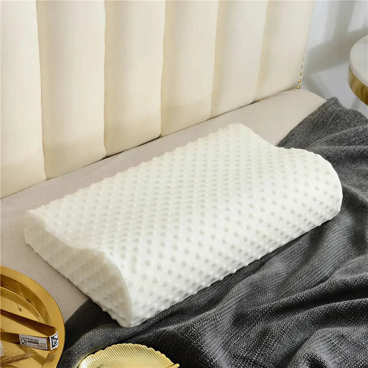 Zora ergonomic memory foam pillow with contoured design for neck support and comfort, shown in a close-up view.