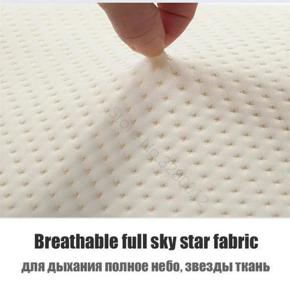Zora ergonomic memory foam pillow with contoured design for neck support and comfortable sleep.