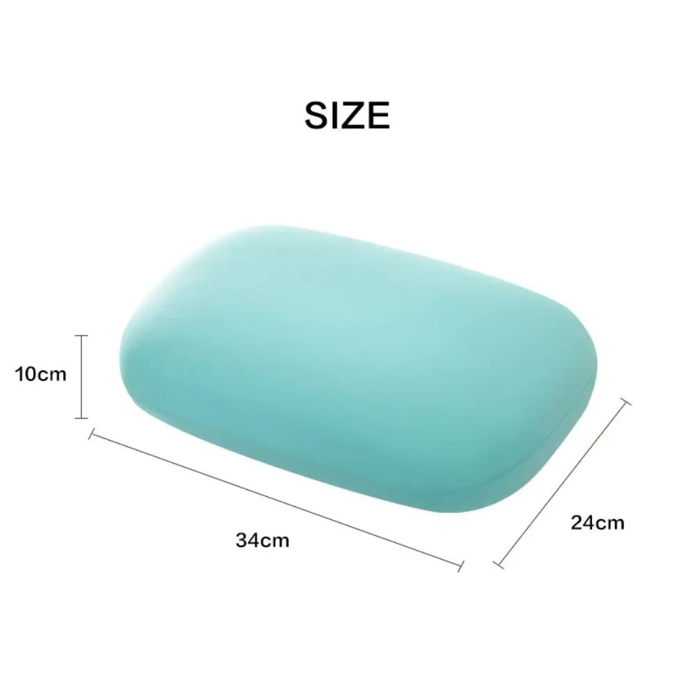 Zora portable macaron-shaped neck support pillow, travel accessory in pastel colors, designed for comfortable neck support during travel.