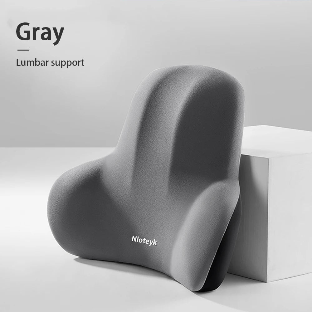 Zora Memory Foam Car Headrest Pillow attached to car seat for neck support and comfort during driving.