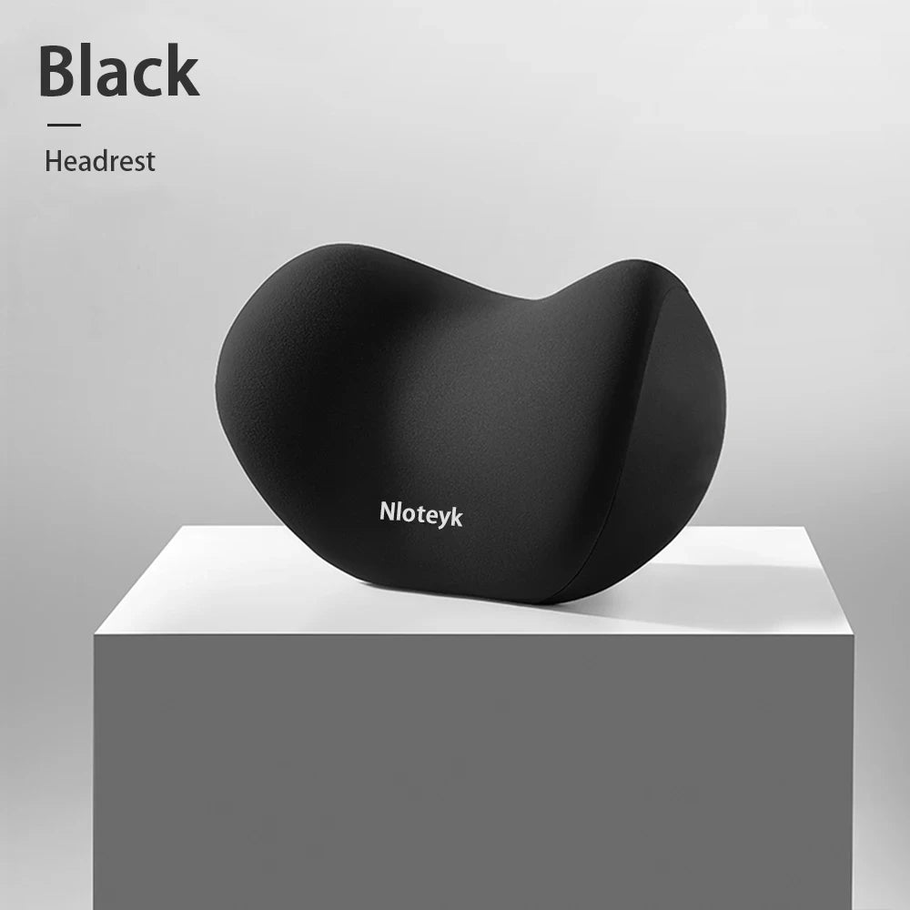 Zora Memory Foam Car Headrest Pillow attached to car seat for neck support and comfort during travel.